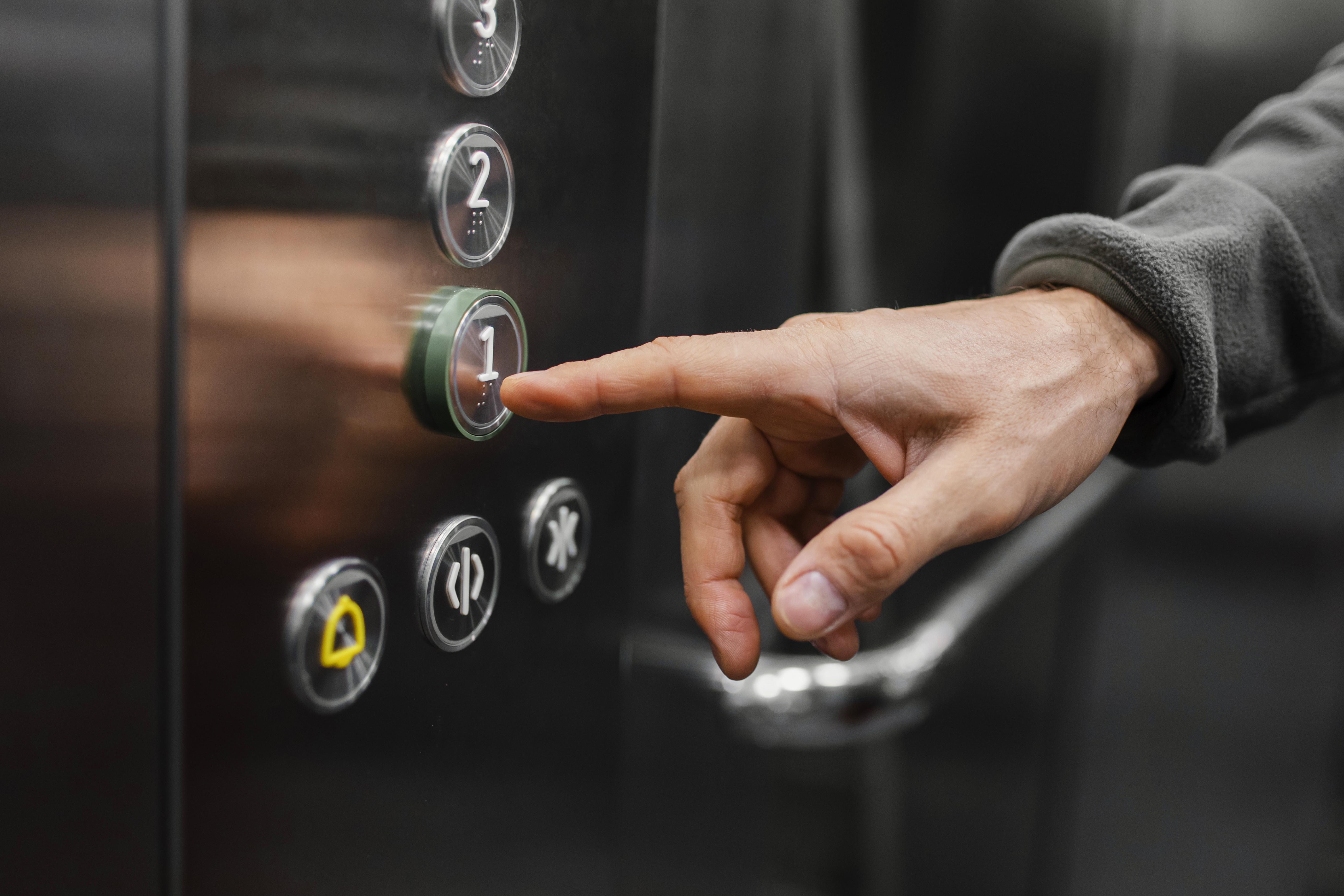 delivery-man-with-package-elevator-close-up (2).jpg